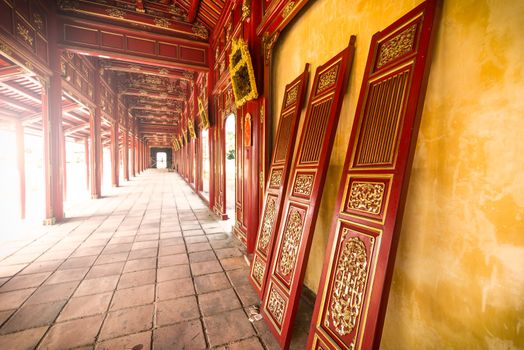 Red wooden hall of Hue citadel in Vietnam, Asia.