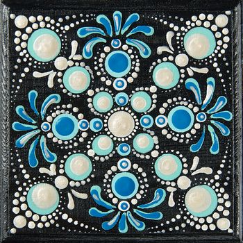 Mandala dot art painting on wood tiles. Beautiful mandala hand p