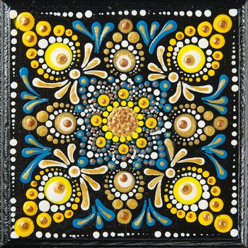 Mandala dot art painting on wood tiles. Beautiful mandala hand p