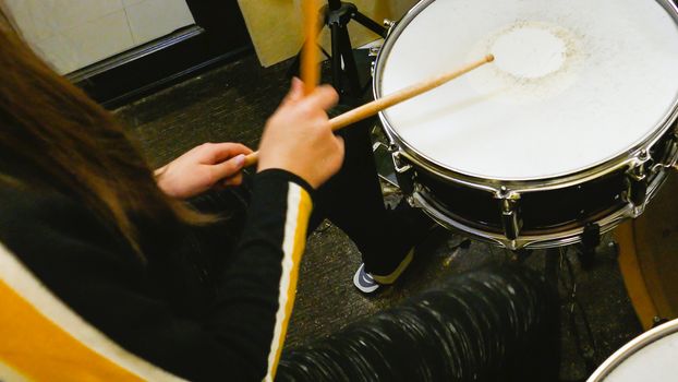 Playing drums on drum kit