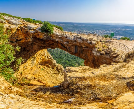 View of the Keshet Cave, a limestone archway spanning the remains of a shallow cave, in Adamit Park, Western Galilee, Northern Israel