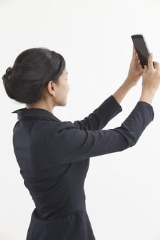Side view business woman self portrait with smart phone
