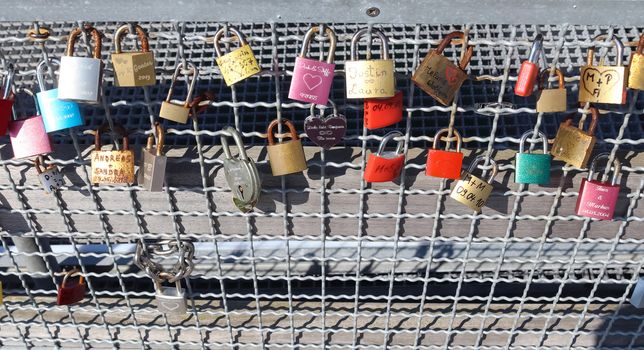 Many Love locks hanging at a pier at a baltic sea beach in Germa