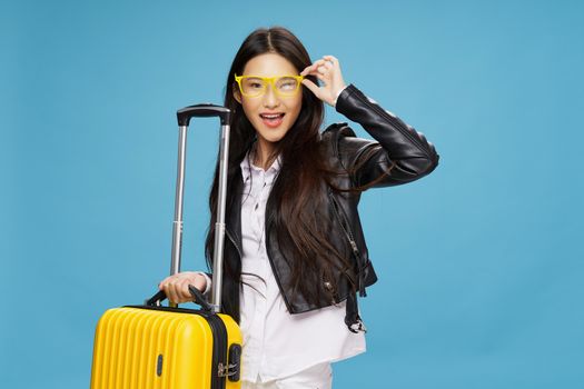 woman with suitcase leather jackets travel glasses elegant style passenger