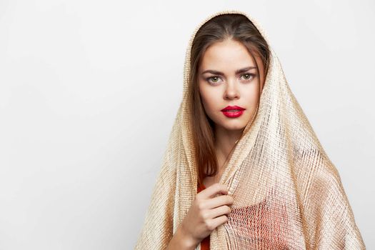 A woman with a shawl Ethnicity is luxury red lips