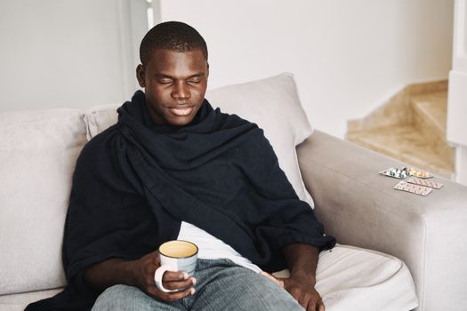 Man at home on the couch cure cold health