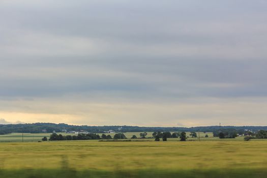 Denmark's landscape seen from the car while driving.
