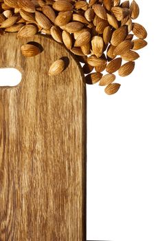 Cutting board and nuts on white background