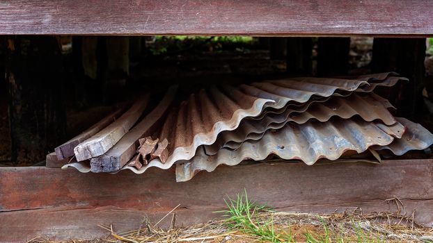 Sheets Of Iron And Timber Thrown Under An Old Disused Building