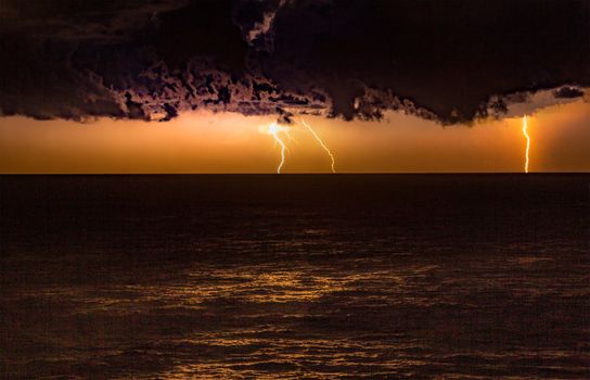 Storm over the ocean with lightning