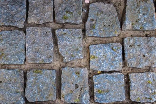 Detailed close up on old historical cobblestone roads and walkwa