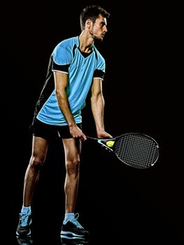 caucasian young tennis player man isolated black background