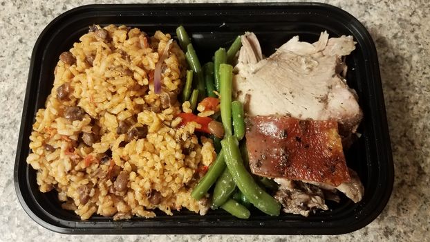 Puerto Rican pork and rice and beans in container