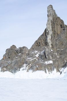 Rock cliff with ice stalactite in Lake Baikal, Russia, landscape