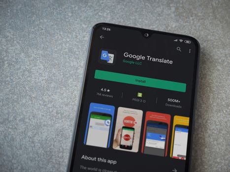 Google Translate app play store page on the display of a black m