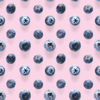 Trendy seamless pattern of blueberries. Blueberry pattern isolated on pink background.