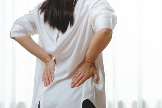 back pain at home. women suffer from backache. healthcare and me