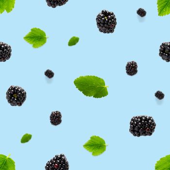 Falling Bramble Seamless pattern. Fresh Falling blackberry seamless pattern. Pattern with fresh wild berries isolated on blue background.