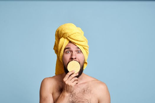 a man with a yellow towel on his head bum bare shoulders clean skin taking a shower