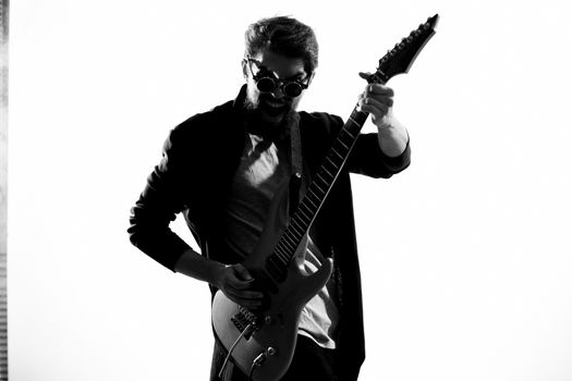 Man with guitar music performance entertainment contemporary performer sunglasses studio