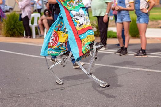 Person On Stilts In Colorful Costume