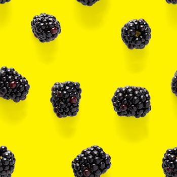 Bramble Seamless pattern. Fresh blackberry seamless pattern. Pattern with fresh wild berries isolated on yellow background.