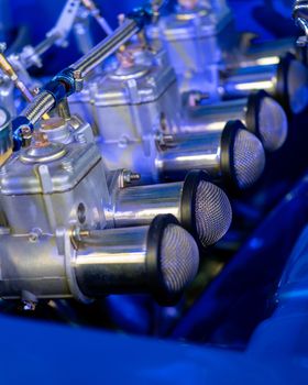 Close Up Of Carburetor In Engine Of Classic Car