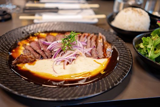A Steak And Potato Mash Dish Served In A Japanese Restaurant