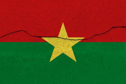 Burkina Faso flag on concrete wall with crack