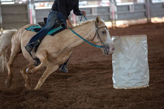 Horse And Rider Barrel Racing At A Rodeo