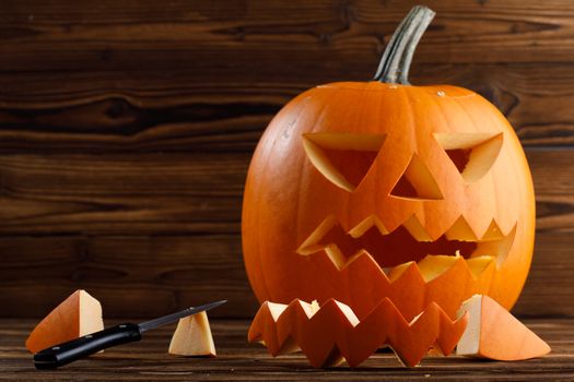 Carving Halloween pumpkin