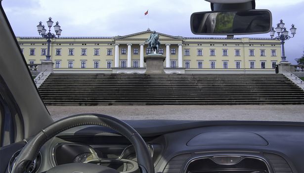 Car windshield with view of Royal Palace in Oslo, Norway