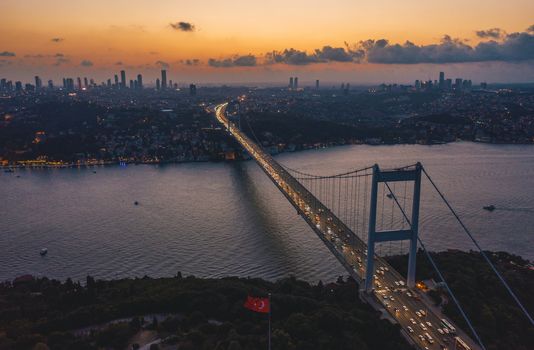 Istanbul Bosphorus Bridge at Dusk Sunset with Car traffic jam and City Skyline, Aerial View