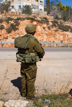 Israeli soldiers patrol in palestinian village