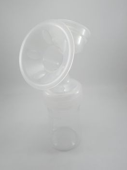 Clear plastic silicone breast pump use for lactating mother