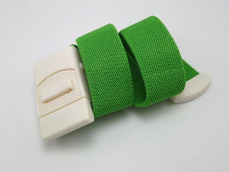 Green adjustable and stretchable fabric belt use to fasten thing