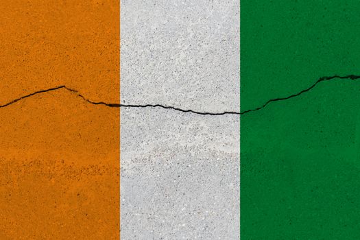 cote d'ivoire - Ivory Coast flag on concrete wall with crack