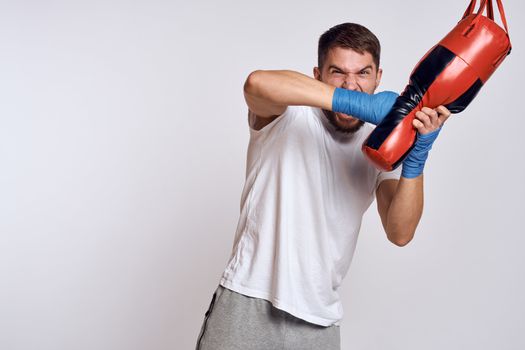Sports car punching bag bandages on the hands of the exercise