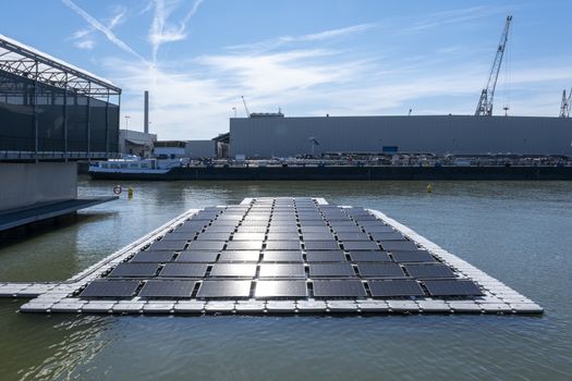 solar panel Floating in a harbour. Used to produce electricity in a clean technology concept