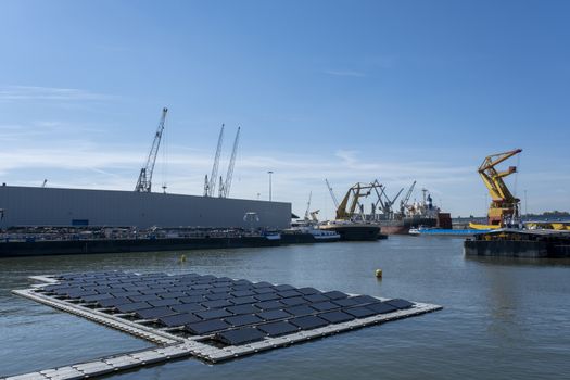 solar panel Floating in a harbour. Used to produce electricity in a clean technology concept