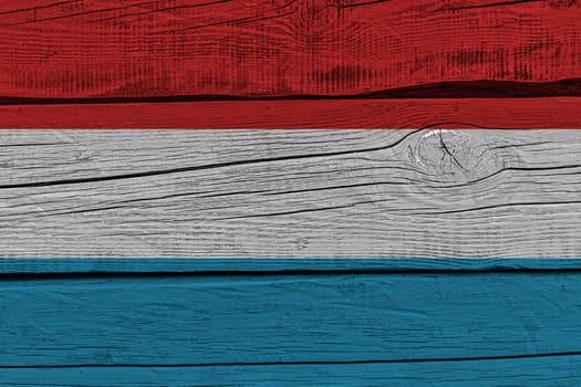 luxembourg flag painted on old wood plank