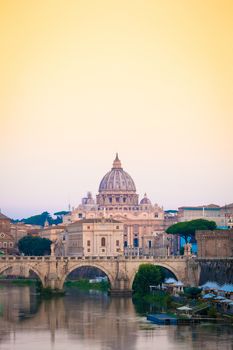 Sunset on Tiber river bridge with Vatican City - Rome, Italy