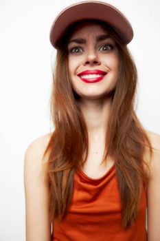 Portrait of a woman in a cap smile strange look red dress