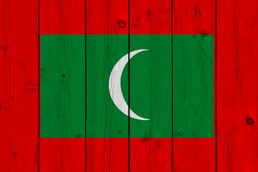 Maldives flag painted on old wood plank
