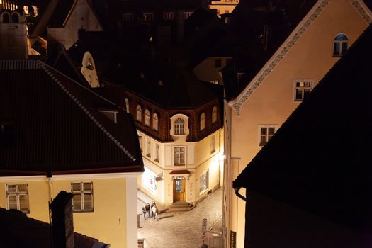 Tallinn, Estonia - October 2018: Old town view from Kohtuotsa to the corner of Pikk and Voorimehe streets at night