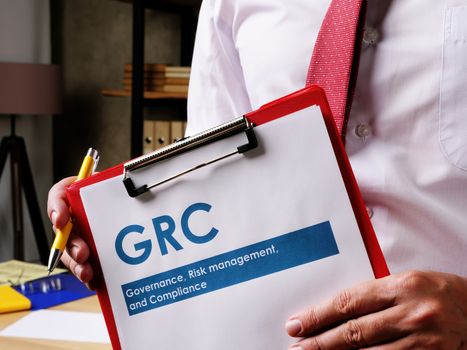 GRC Governance, risk management, and compliance document is in the hands of the manager.