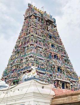 Ancient Hindu temple with beautiful God sculptures in the tower of Kapaleeshwarar temple in Tamil nadu.