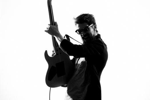 Man with guitar music performance entertainment contemporary performer sunglasses studio