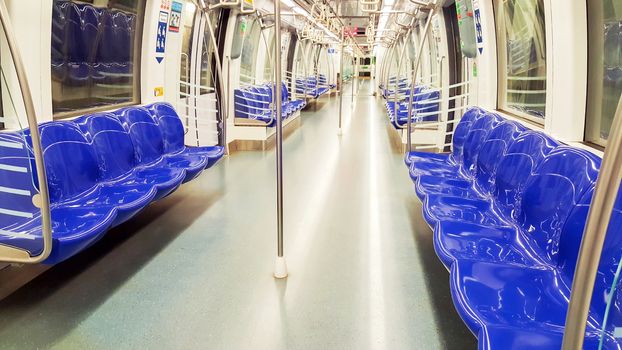 Empty chairs in the metro.