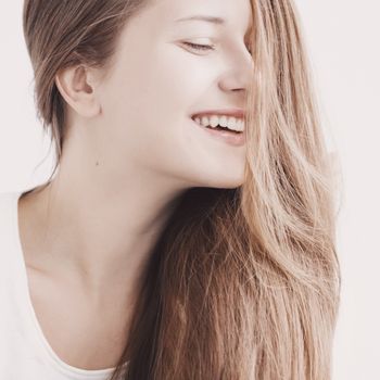Positive beauty, closeup face portrait of young woman with long hairstyle and natural makeup look for female hair care, cosmetic or skincare brands